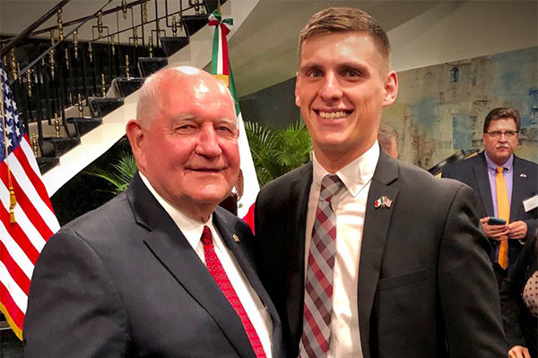 Industry & Global Trade Coordinator, Dillon Davidson meets with USDA Secretary Sonny Perdue at USDA FAS Trade Mission to Mexico in 2019. 