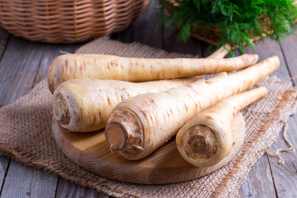 Photo of whole parsnips on a table. 